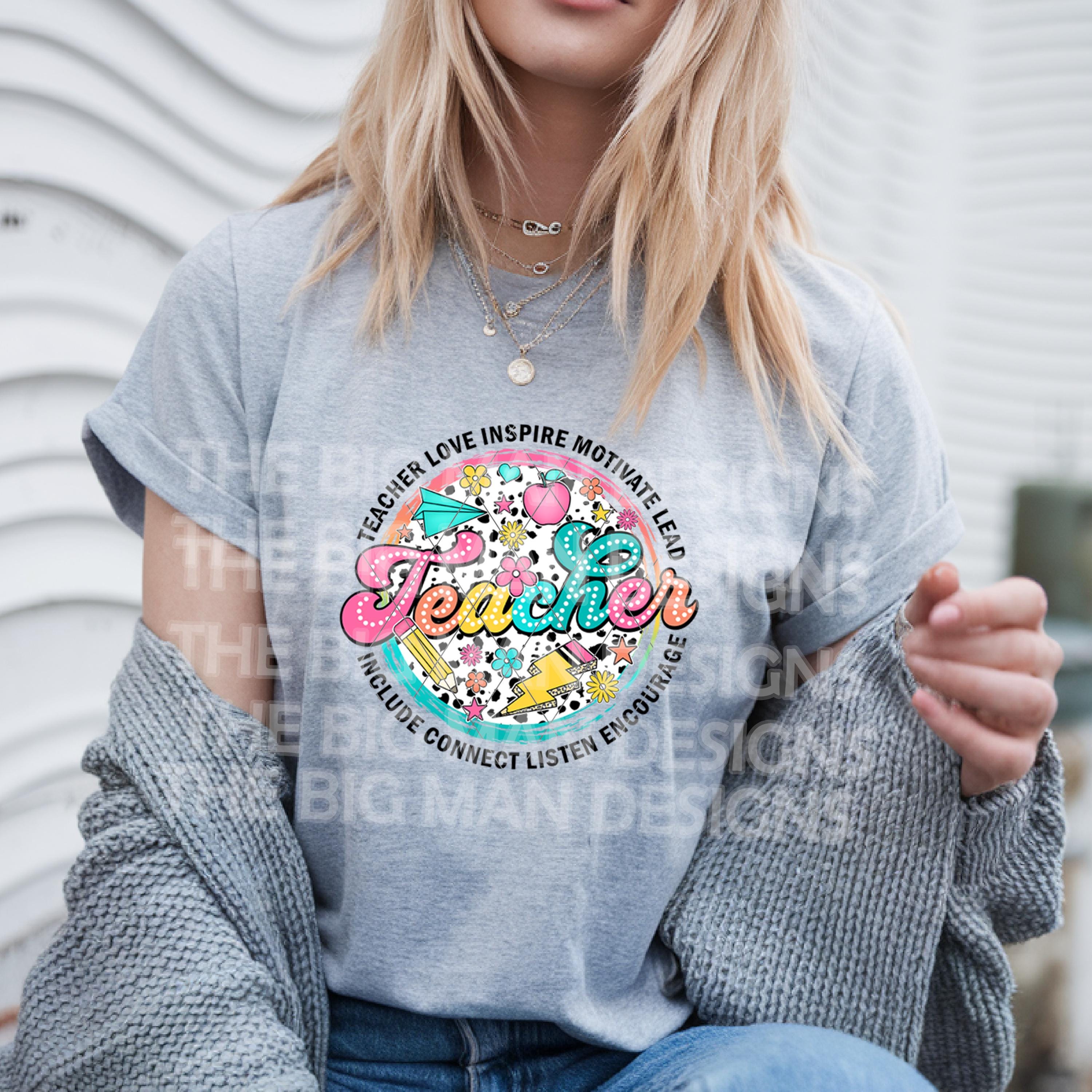 "Teacher graphic on grey tshirt worn by smiling woman"