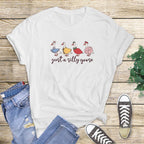White flat lay T-shirt with "Just a Silly Goose" multi-goose lineup design.