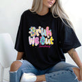 girl smiling wearing a black shirt with "Bruh We Out" and blue jeans. A great teacher gift for the end of the year or teacher appreciation.