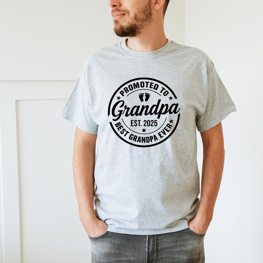 Matching shirts laid out side-by-side with "Promoted to Grandma" and "Promoted to Grandpa" designs