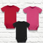 Gerber red, black, and hot pink onesies
