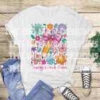 White t-shirt styled flat lay with jeans and sneakers, featuring "Teaching is a Work of Heart" bright pencil and flower print.