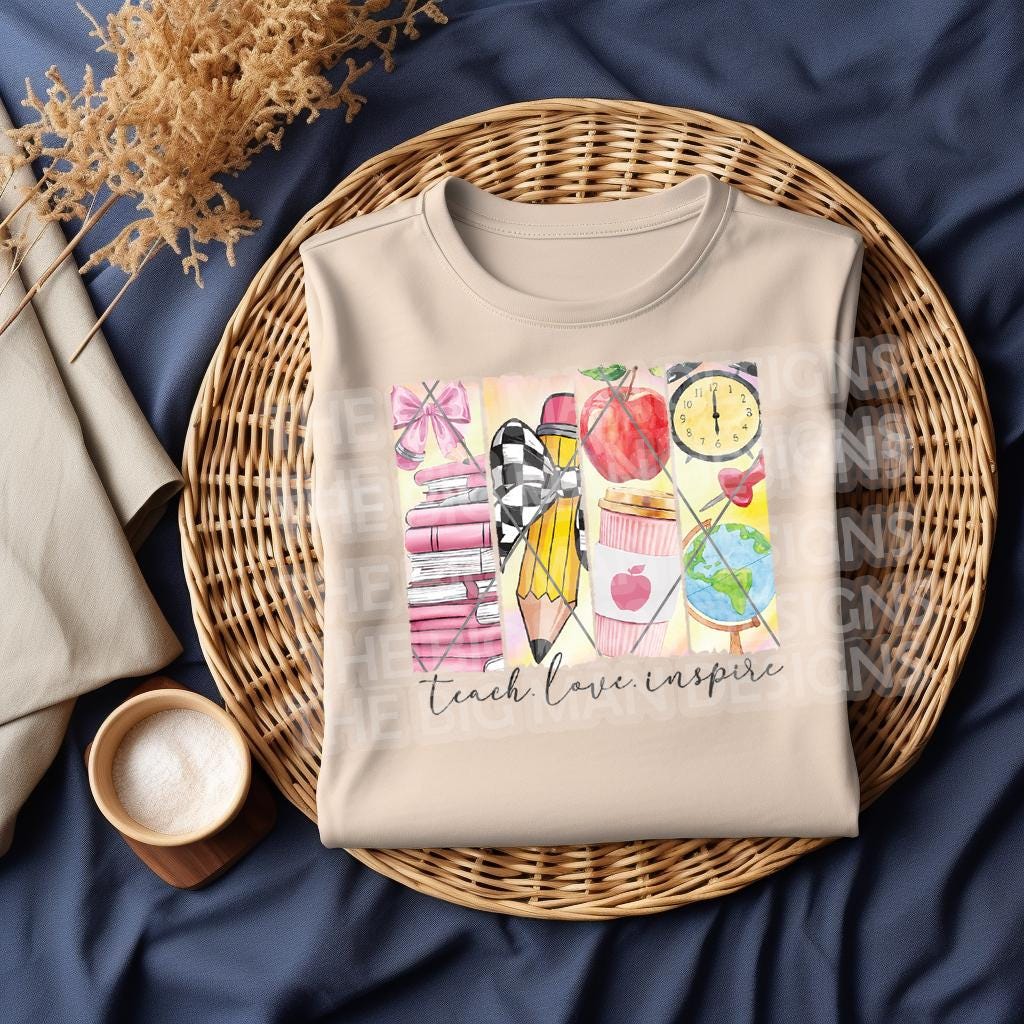 Folded natural color sweatshirt with colorful school-themed "Teach Love Inspire" design