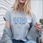 Grey Senior Est. 2025 T-shirt styled with jewelry and cozy sweater.