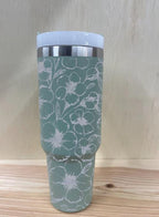 Side view of engraved tumbler showing seamless floral detailing