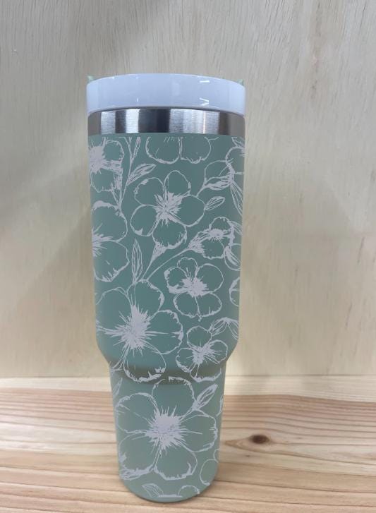 Side view of engraved tumbler showing seamless floral detailing