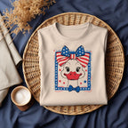 Beige t-shirt with patriotic goose DTF design folded in basket