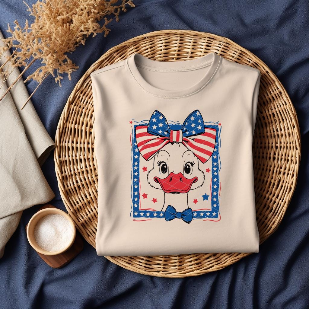 Beige t-shirt with patriotic goose DTF design folded in basket
