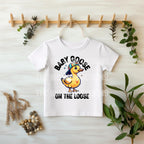 White T-shirt hanging with Baby Goose On The Loose DTF transfer, styled with greenery