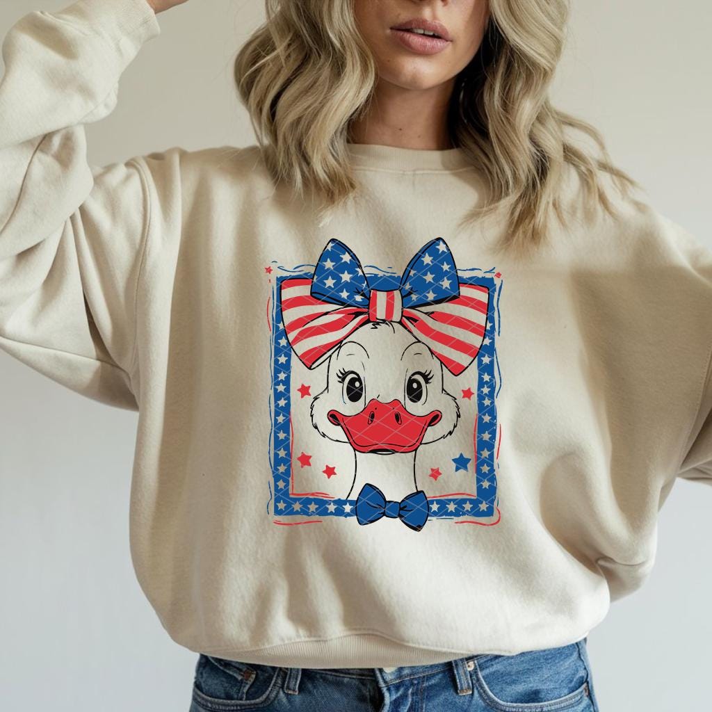 Natural color sweatshirt featuring Patriotic Goose DTF transfer with American flag bow.