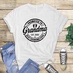 white t-shirt with black "Promoted to Grandma" print.