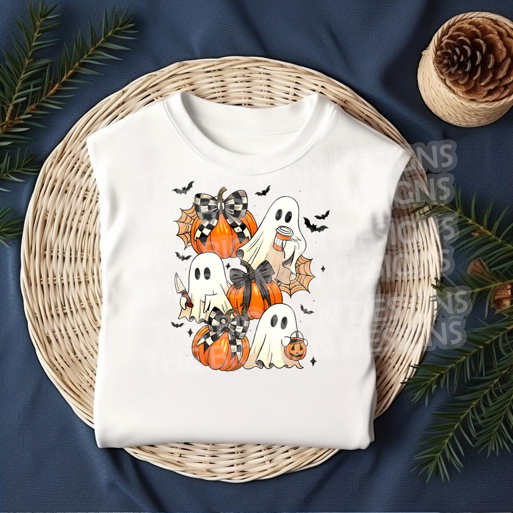 Flat lay mockup of white shirt with pumpkin ghost and bow DTF transfer applied