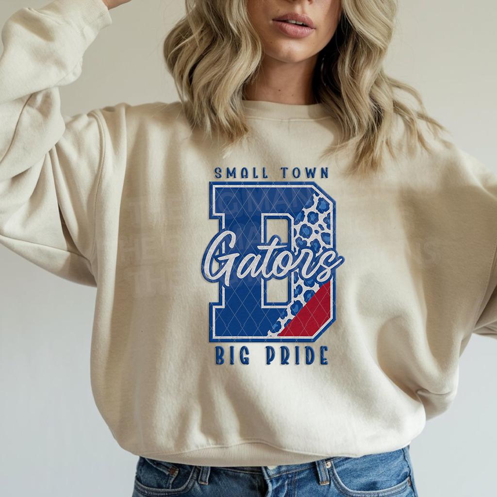 Model wearing Small Town Big Pride Gators DTF transfer on natural sweatshirt