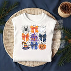 Flat lay mockup of white shirt with coquette bow and haunted house Halloween DTF transfer