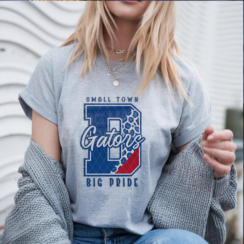 Model wearing grey T-shirt with Gators mascot school spirit transfer design