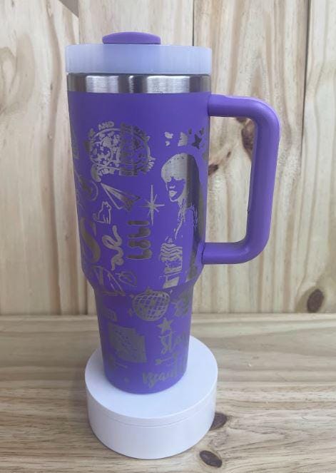 Design on purple 40 oz tumbler with steel design