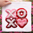 XOXO Valentine faux chenille style DTF heat transfer on white tshirt with textured heart design- close up so you can see the texture