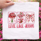 Love Like Jesus Valentine faith shirt with floral bow cross design outdoors mockup