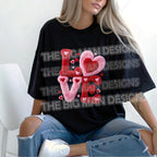 Oversized black t-shirt featuring fuzzy chenille LOVE heart Valentine design worn by model