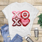 XOXO heart Valentine DTF transfer displayed on white t-shirt flat lay heat press ready design