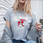 Be Brave Take WISCs with white and red lettering on a grey tshirt lifestyle mockup
