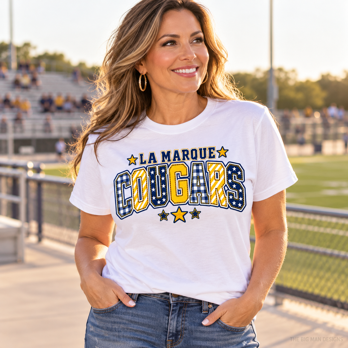 Customer wearing a white La Marque Cougars patchwork varsity school spirit T-shirt.