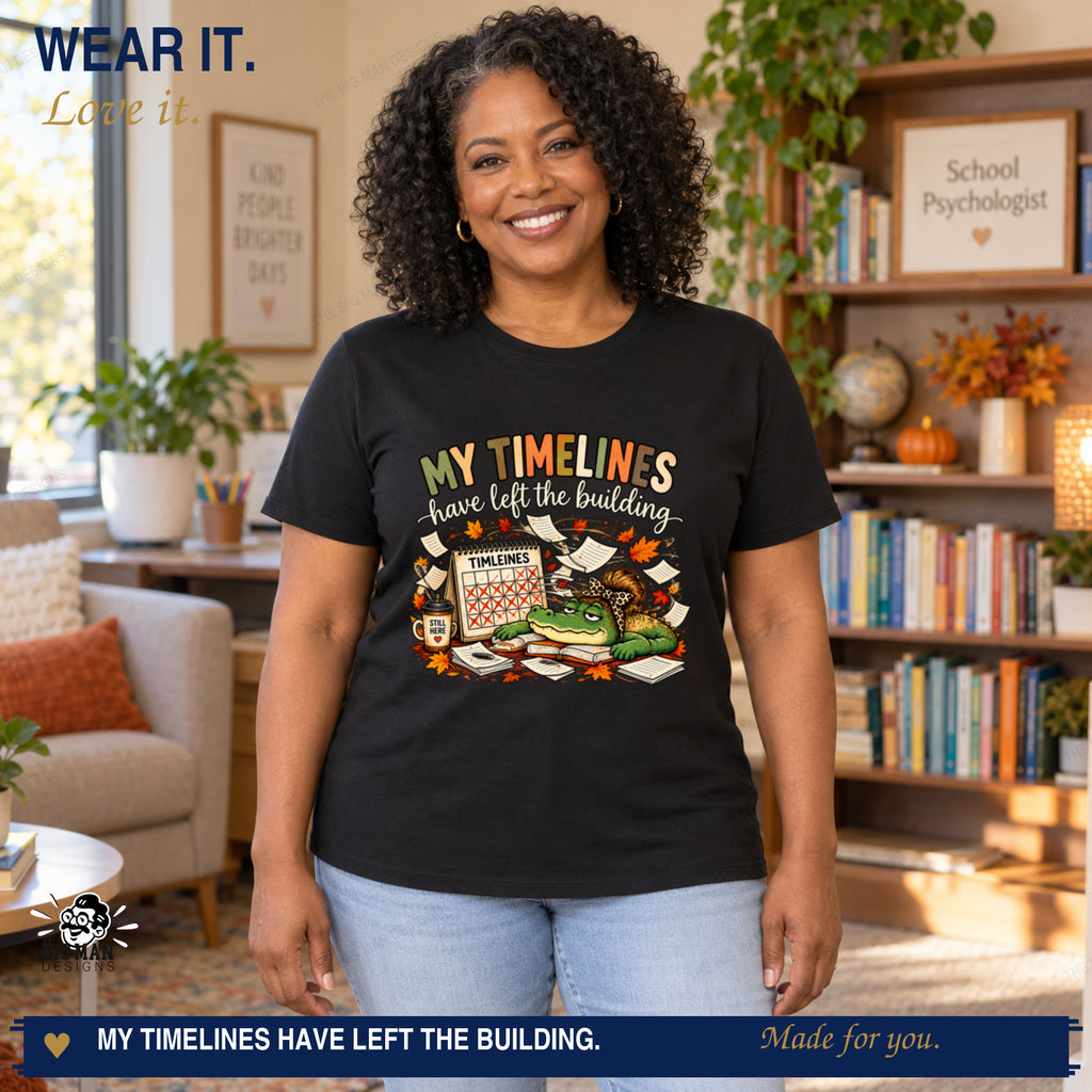 Curly-haired woman modeling the timeline humor gator T-shirt with the front print placed entirely within the shirt torso.