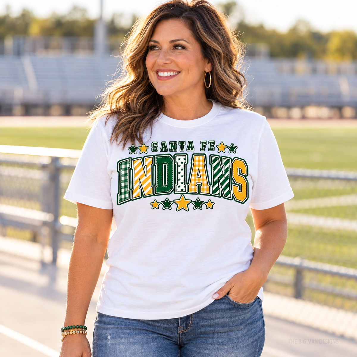 Customer wearing a white Santa Fe Indians patchwork varsity school spirit T-shirt.